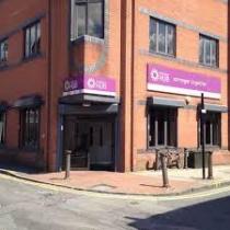 The outside picture of Bolton CVS building entrance on the corner of a street