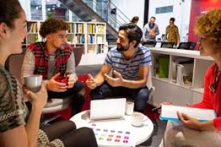 Staff mentoring a group of people