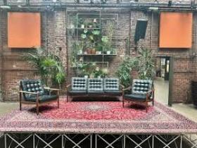 A picture of a stage and chairs, showcasing their 'venue' offer