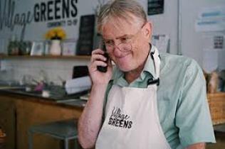 A shopkeeper on the phone