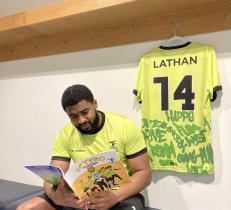 A picture of Lathan reading one of his FC Tyro books