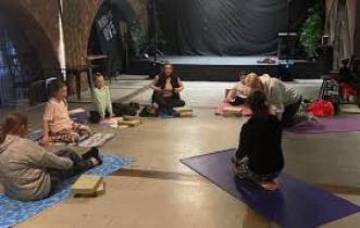 A picture of a group of women doing yoga