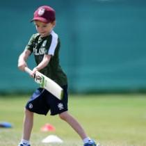Image of a young boy playing cricket