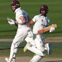 Image of two players playing cricket