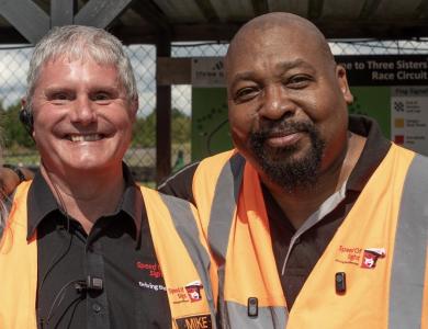 A photo of two founders smiling stood together
